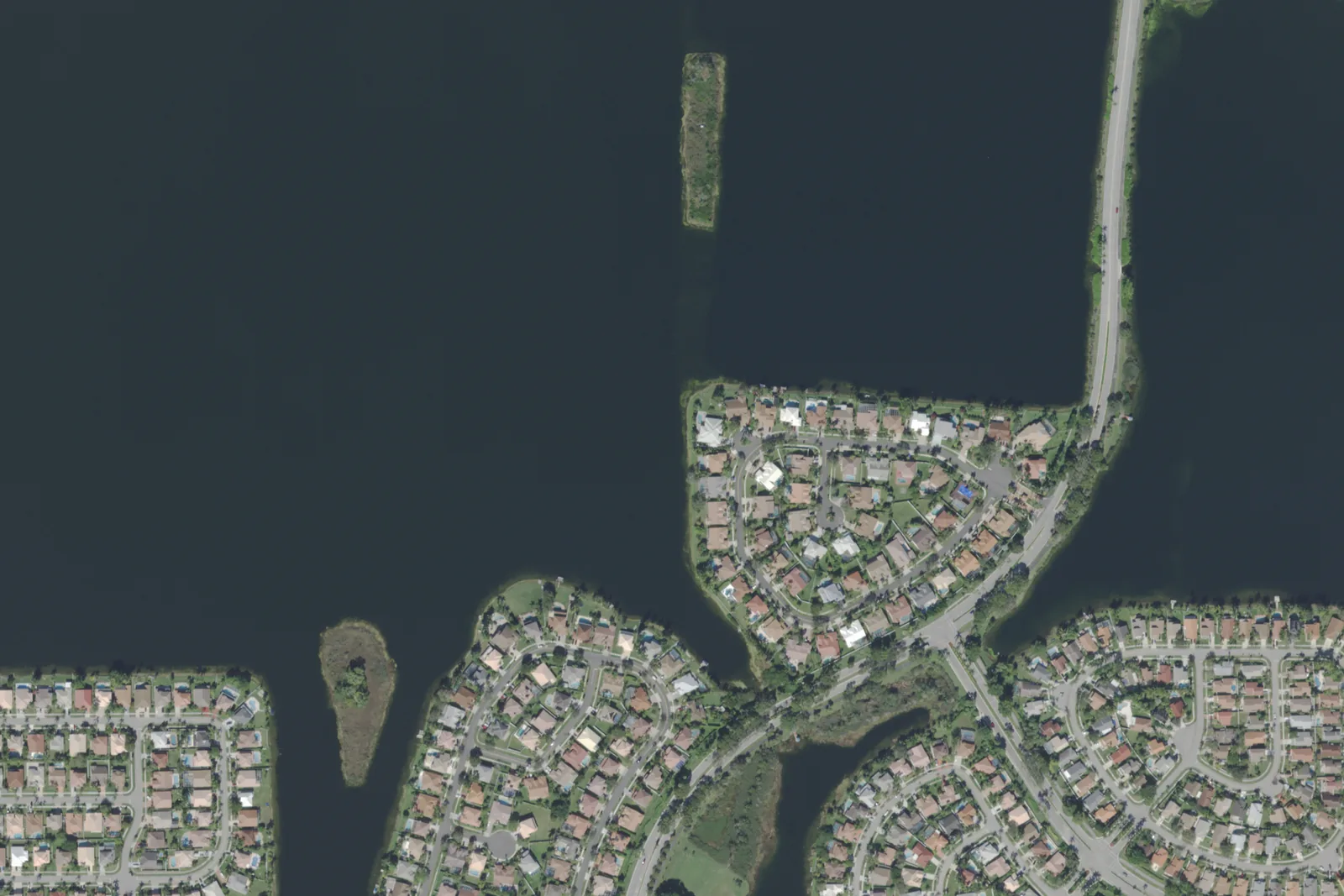 Homes on the lakes of Silver Lakes, north of Pines Boulevard in Pembroke Pines, in a 2021 USDA aerial photograph