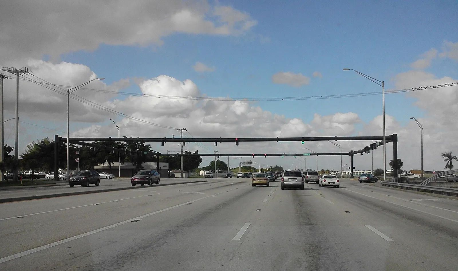 Traffic signals over the wide intersection of University Drive and Pembroke Road on the Pembroke Pines and Miramar line.